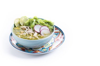 Traditional mexican green pozole soup isolated on white background. Copy space clipart