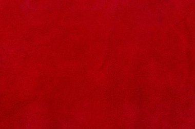 Doğal kırmızı boyanmış deri, süet makro fotoğraf. Kırmızı süet dokusu.