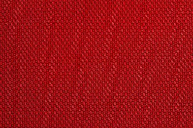Kumaş dokusu. Arka plan makro fotoğrafı olarak kırmızı kumaş.