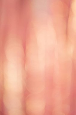 Terracotta renginin ve sarı rengin defocus ışıkları. Bulanık simli arkaplan, bokeh