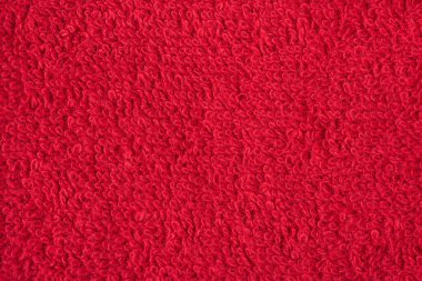 Kırmızı havlunun dokusunun makro fotoğrafı.