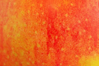 Arka plan olarak kırmızı ve sarı elma dokusu.