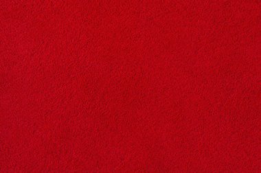 Süet kırmızı makro fotoğraf. Arka plan olarak süet deri dokusu