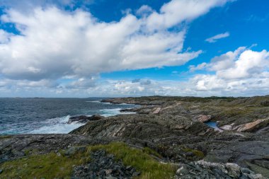 Overlooking the coast near Bleivik Lighthouse, Hagland peninsula, Haugesund, Rogaland, Norway clipart