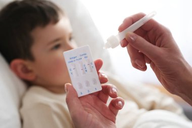 A little boy is sick, a combo antigen test (covid-19, flu a b, RSV) is needed for proper diagnosis.