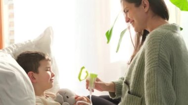 Mom and son are doing inhalation due to flu.