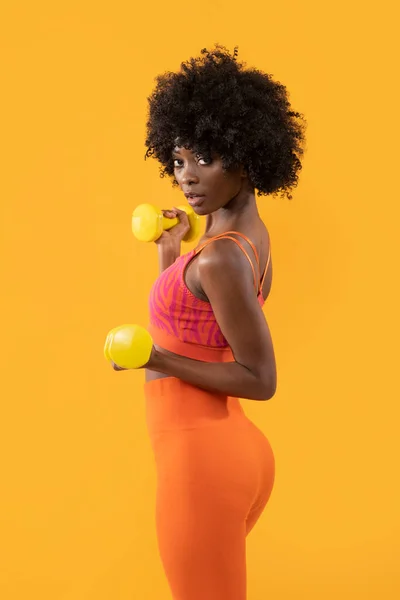 Dark Skin Female Fitness Trainer Afro Hair Dumbbells Isolated Orange — Stock Photo, Image
