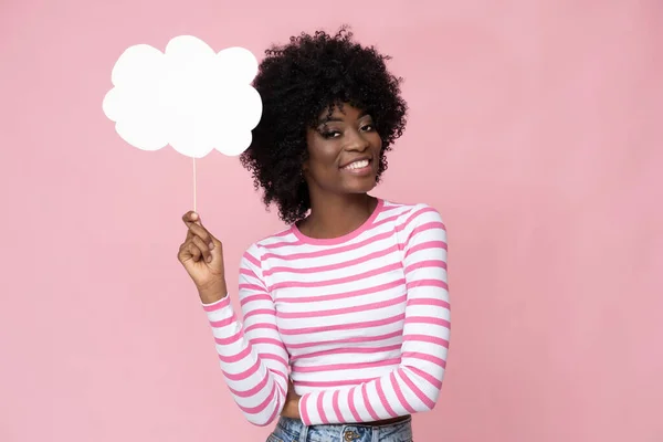 Happy African female model with white banners on pink background.