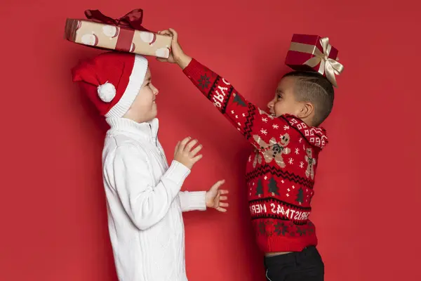 Two Boys Have Fun Chrismas Gifts Red Background — Stock Photo, Image