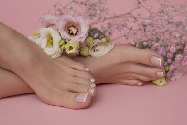 Perfectly done french manicure on woman feet.