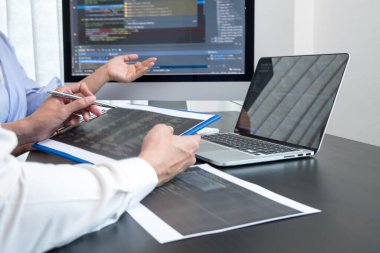 Team of programmers working with computer programming, professional development, and coding technology, working on high-quality visual software development websites.