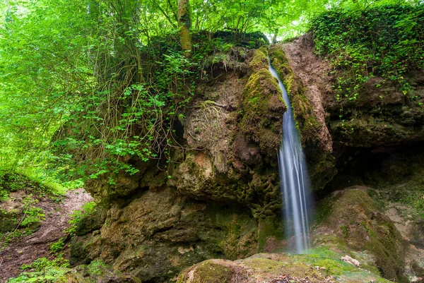 stock image Csurgokut is a small forest waterfall near Farkasgyepu, Bakony in Hungary.