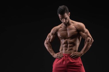 Handsome Muscular Men , studio shot against black background