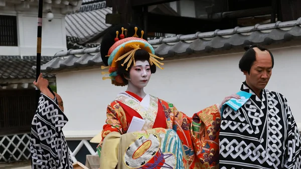 stock image Nikko, Japan - May 1 2023: the unidentified artist dress like Geisha in the parade of theme park in Japan near Kinugawa in Edo Wonderland. Edo Wonderland is edo peroid theme park in Japan