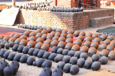potter is under sun-dried pocessing in the Talako Tole or so called pottery square.