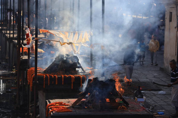 Kathmandu, Nepal - November 22 2023: the cremation is take placed in the Pashupatinath Temple, it is traditional ceremony in kathmandu.
