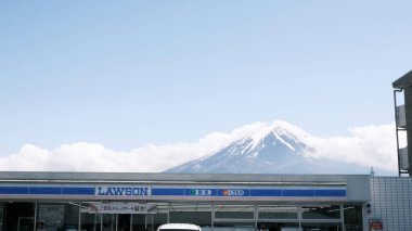 Kawaguchiko, Japan- May 22 2024 : Japan blocks iconic Mt Fuji view behind the convenience store Lawson to deter tourists clipart