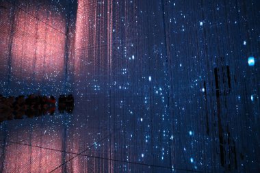 Tokyo - May 4 2023: people experience the light show in teamLab Planets at Odaiba. it is well known as an international art collective in tokyo. clipart