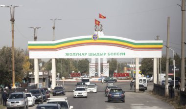 Tokmok, Kyrgyzstan - October 3 2024:the flags and logo of Soviet Union style in  townscape of Tokmok. this is one of slik road city, Tokmok is one of important town in western area of Issyk-Kul clipart