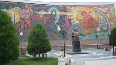 Tashkent, Uzbekistan- October 5 2024: Taras Shevchenko, Ukrainian literary hero, was born on this day in 1814. Here is his mural and statue in Tashkent, Uzbekistan clipart