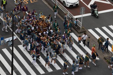 Tokyo- May 12 2024: Motomishima Shrine Grand Festival is take place in Arakawa, Tokyo. The joint procession of portable shrines from each of the clans and town councils passing in front of Shrine clipart