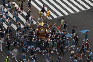 Tokyo- May 12 2024: Motomishima Shrine Grand Festival is take place in Arakawa, Tokyo. The joint procession of portable shrines from each of the clans and town councils passing in front of Shrine clipart