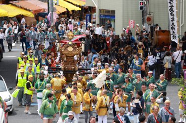 Tokyo- May 12 2024: Motomishima Shrine Grand Festival is take place in Arakawa, Tokyo. The joint procession of portable shrines from each of the clans and town councils passing in front of Shrine clipart