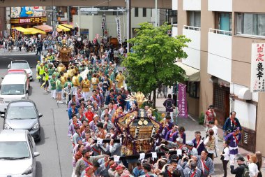 Tokyo- May 12 2024: Motomishima Shrine Grand Festival is take place in Arakawa, Tokyo. The joint procession of portable shrines from each of the clans and town councils passing in front of Shrine clipart