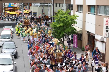 Tokyo- May 12 2024: Motomishima Shrine Grand Festival is take place in Arakawa, Tokyo. The joint procession of portable shrines from each of the clans and town councils passing in front of Shrine clipart