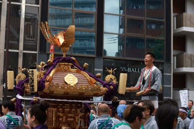 Tokyo- May 12 2024: Motomishima Shrine Grand Festival is take place in Arakawa, Tokyo. The joint procession of portable shrines from each of the clans and town councils passing in front of Shrine clipart