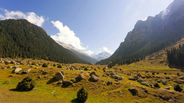 autumn view of Altyn Arashan area in Kyrgyzstan and Tien Shan mountain range clipart