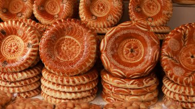 Central Asia bread, called generally non or lepeshka from tandyr and sell in the market of bishkek clipart