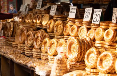 Central Asia bread, called generally non or lepeshka from tandyr and sell in the market of bishkek clipart