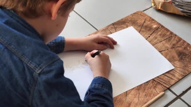 Little Boy Draws While Lying Ground — Stock Video