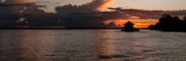 Dramatic Sunset Over the Amazon River in Colombia, Captured from Amacayacu National Park. clipart