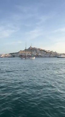Ibiza, Spain, 30 may 2022. Vertical video. Views of the beautiful Ibiza old town Dalt Vila with its castle from Marina Botafoch over the sea in the port.