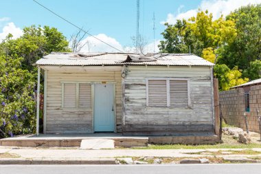 Pedernales, Dominican Republic, 8 august 2025. Typical Dominican Caribbean house made of wood, painted white.
