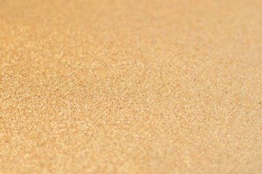 Parlak bulanık bokeh ile altın ışıltılı arka plan.