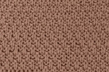 Pembe örülmüş kumaş inci yünlü arka plan. Kumaşın doğal bir dokusu var. Kumaş arka plan. Örülmüş yün arkaplan