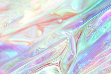 Pastel gölgeli ve yansıtıcı kıvrımlı holografik renklerin soyut deseni
