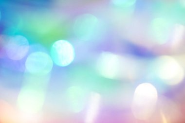 Yaratıcı bir arkaplan için yumuşak tonlarda parlak ve renkli bokeh ışıkları