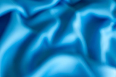 Bulanık mavi kumaş kıvrımları huzurlu ve huzurlu bir atmosferi çağrıştırıyor.