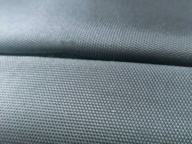 Arkaplan için gri kumaşın soyut dokusu