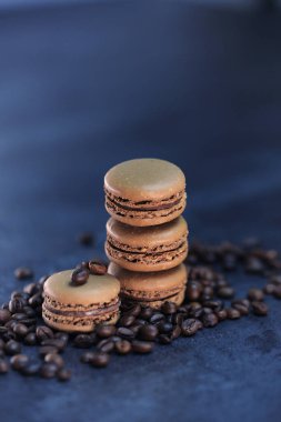 macaroon with coffee on a black background