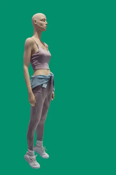 全长的女模特形象 穿着时髦的运动服 背景为绿色 — 图库照片