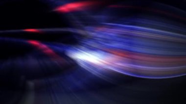 Mavi kırmızı ve sarı neon iplikler birbirine karışıyor ve karanlık bir arka planda yön değiştiriyor.