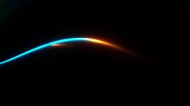 Mavi balık, parlak bir ışık şeklinde koyu bir arkaplandan geçiyor.