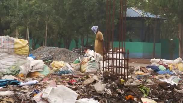 Man Drinking Bottled Water Took Sack Garbage Disposal Area — Stock Video