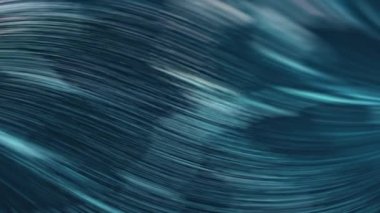 Okyanusun mavi suyu ve hareket halindeki dalgaları manzaralı ve soyut bir zemin oluşturur.