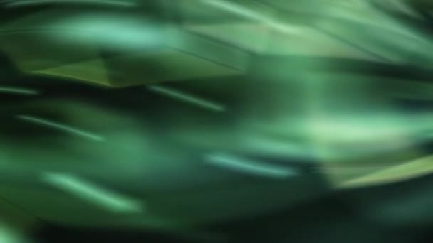 写真は抽象的なブラック グリーン ブルーブラウンの鮮やかな緑と青の背景を示しています — ストック動画
